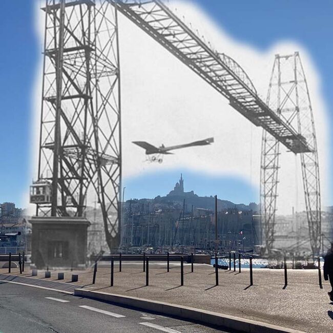 un avion passe sous le pont transbordeur