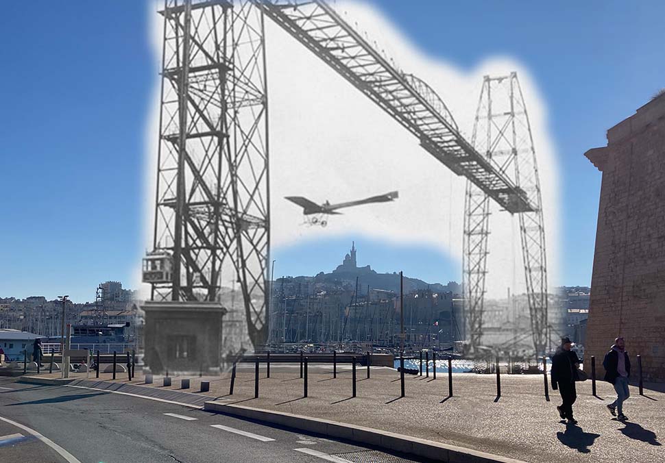 un avion passe sous le pont transbordeur